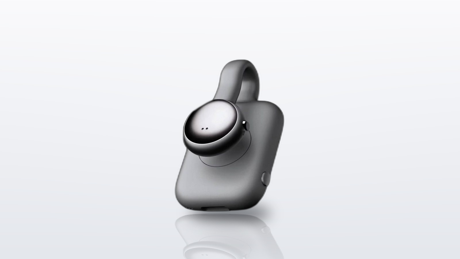 Dark gray SwitchBot AI MindClip recorder beside its charging case