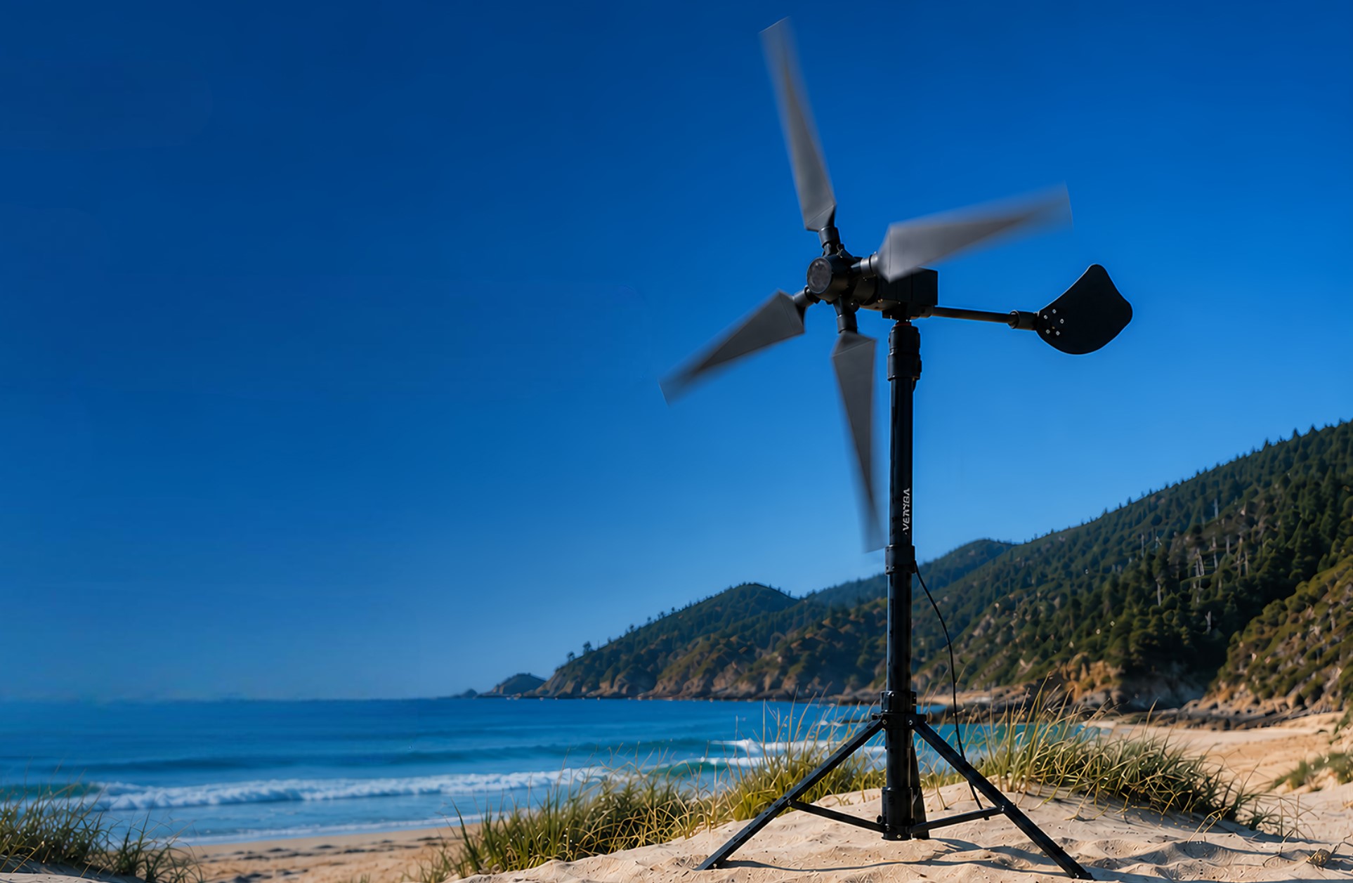 VENTYRA R1 portable wind turbine spinning on a tripod beside the coast