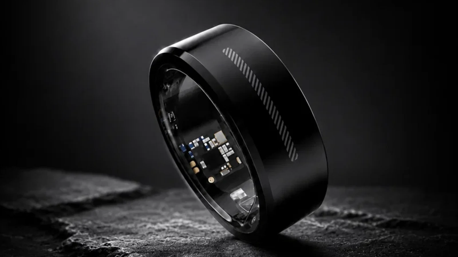 Black KiWear ceramic gesture ring showing the touch strip and internal electronics