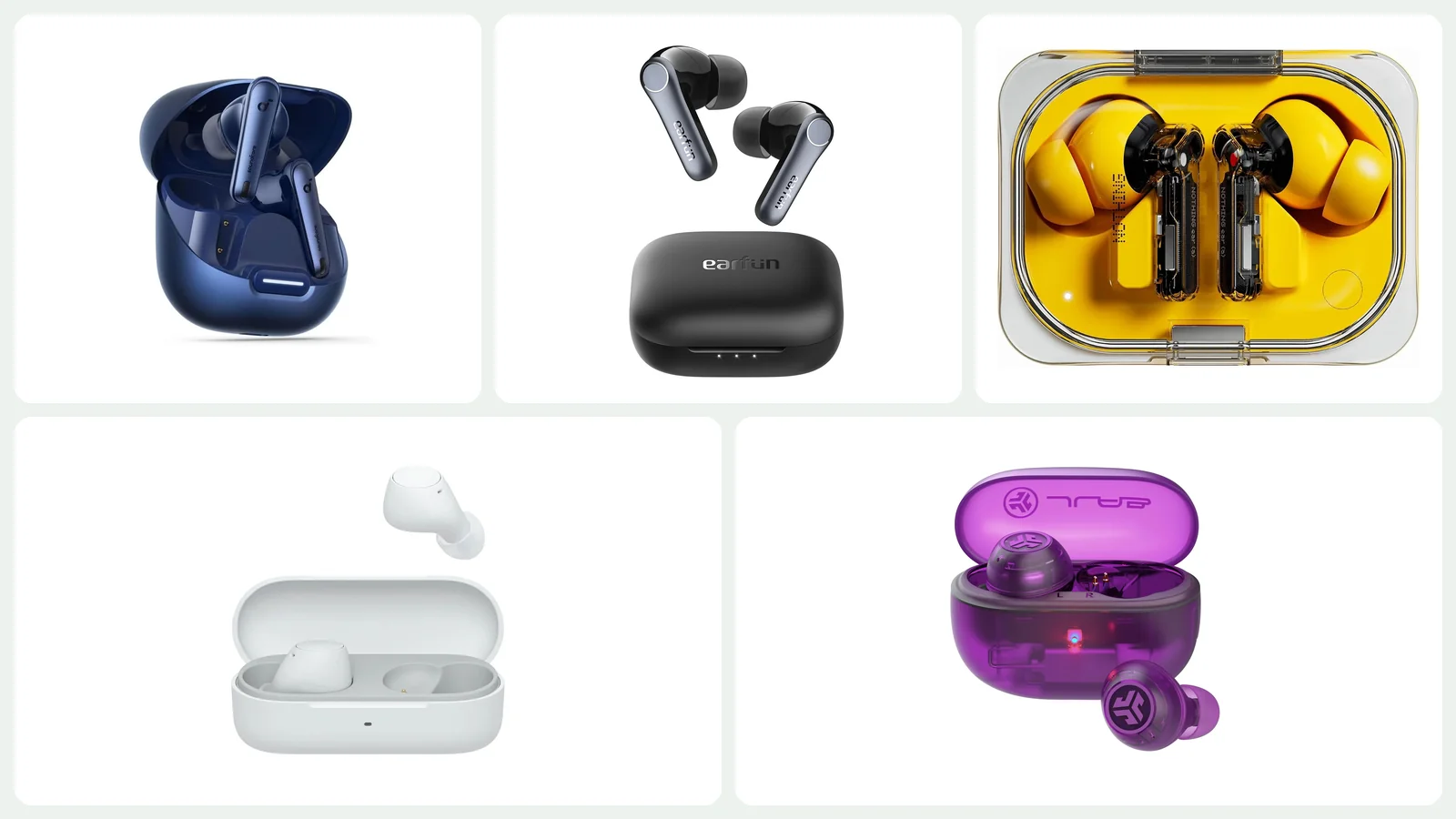 Wireless earbuds and charging cases arranged on a light surface
